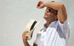 how-to-stop-sweating-in-the-summer-heat-sun-sweat-men-health-body-man-e1485966375156